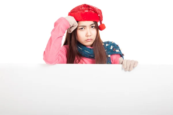 Asian girl with red christmas hat in bad mood with blank sign — Stock Photo, Image