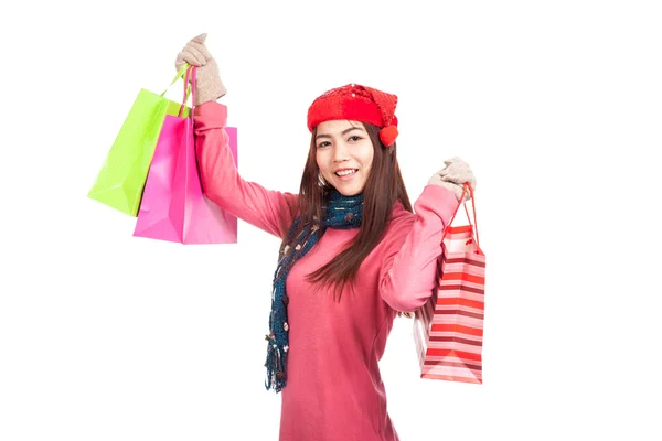 Asiática chica con rojo navidad sombrero con bolsas de compras — Foto de Stock