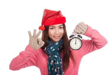 Kırmızı Noel şapka ile Asyalı kız göster: Ok ve çalar saat