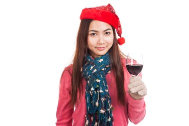 Asyalı kız kırmızı Noel şapka ve bir kadeh şarap ile