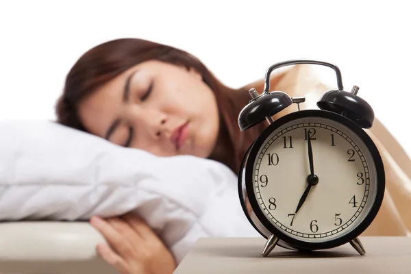 Sleeping Asian girl with alarm clock — Stock Photo, Image