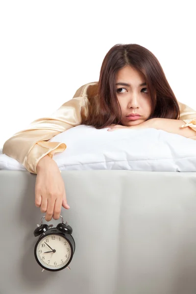 Sleepy Asian girl  wake up in bad mood with  alarm clock — Stock Photo, Image