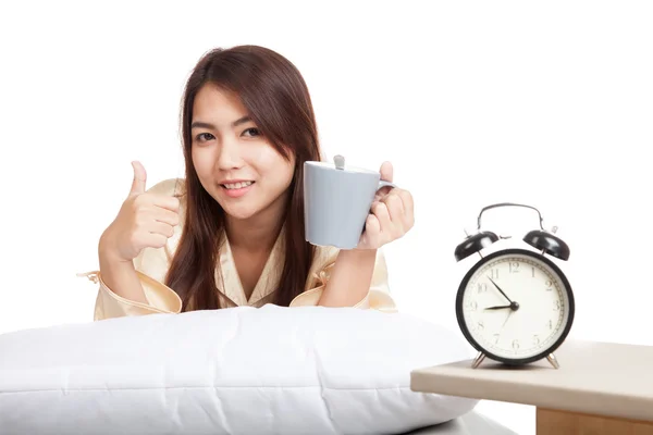 Happy Asian girl  wake up , thumbs up with alarm clock and  coff — Stock Photo, Image