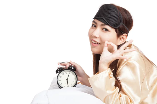 Asian girl wake up show OK with eye mask  and alarm clock — Stock Photo, Image