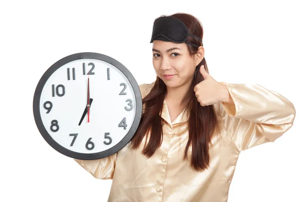 Happy Asian girl with eye mask and clock show thumbs up — Stock Photo, Image