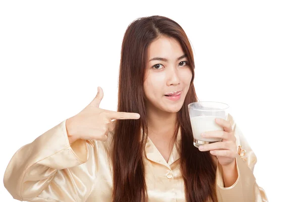 Asian woman  licking her lip point to glass of milk — Stock Photo, Image