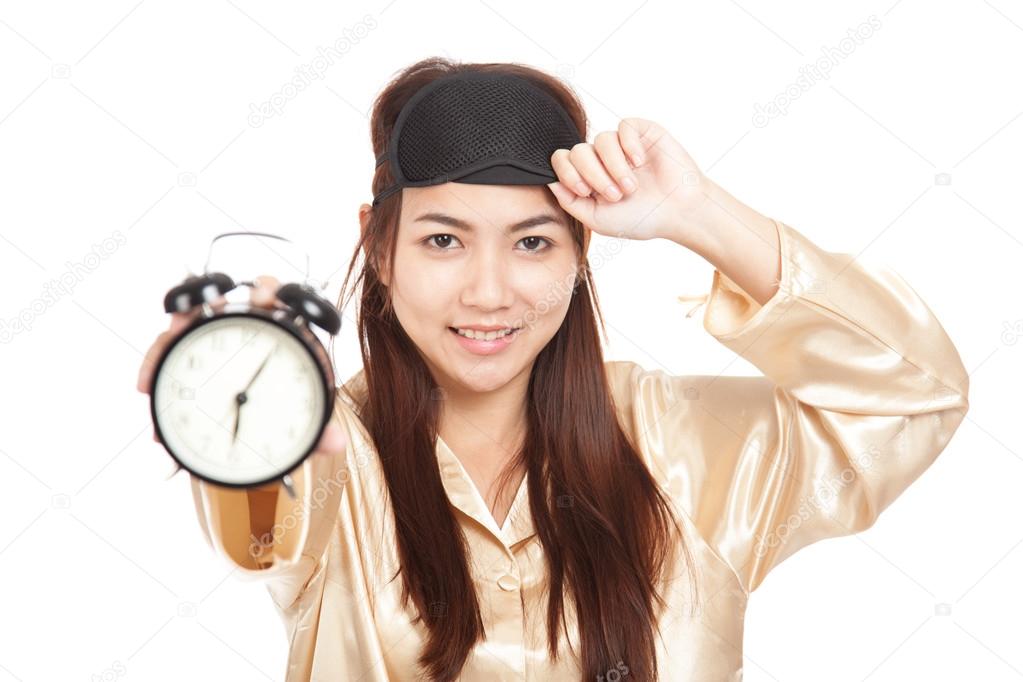 Happy Asian girl  wake up early morning show alarm clock