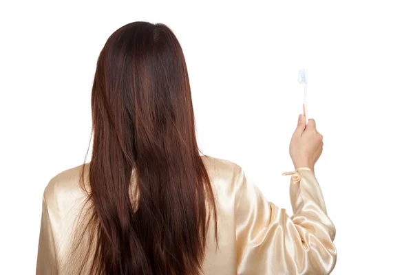 Espalda de mujer asiática en pijama con cepillo de dientes —  Fotos de Stock
