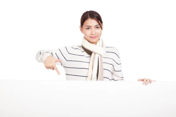 Beautiful Asian girl with scarf point to blank sign — Stock Photo, Image