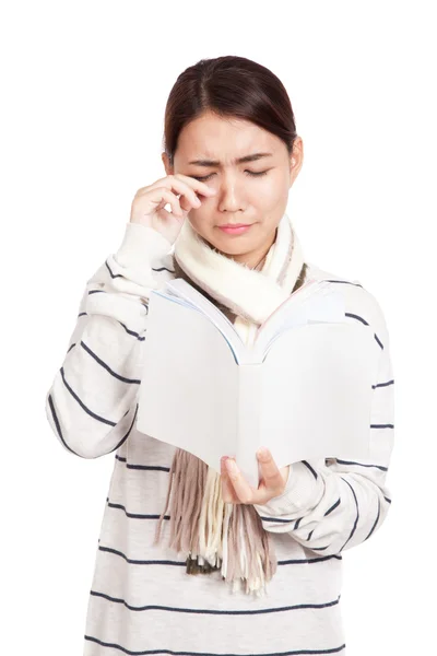 Beautiful Asian girl with scarf crying read a book Stock Image