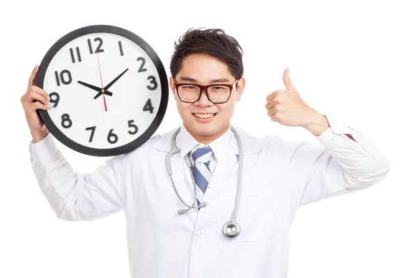 Asian male doctor show thumbs up with a clock — Stock Photo, Image