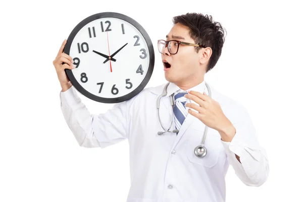 Asian male doctor shock look at a clock — Stock Photo, Image