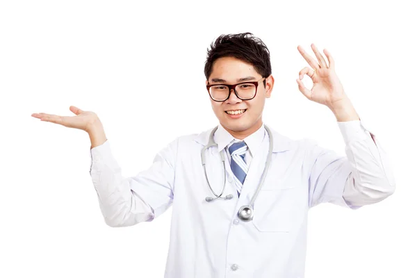 Asian male doctor show palm hand and OK sign — Stock Photo, Image