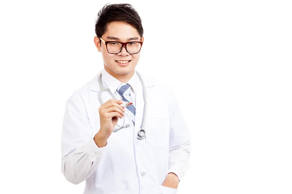 Asiatisk mandlig læge skriver i luften med rød markør - Stock-foto