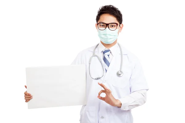 Asian male doctor wear mask show OK with blank banner — Stock Photo, Image