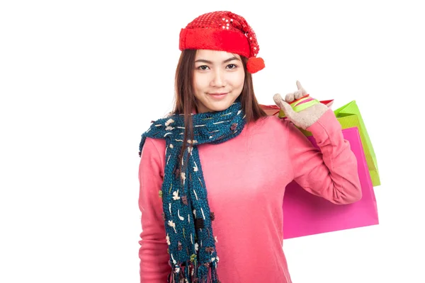 Asian girl with red christmas hat with shopping bags — Stock Photo, Image