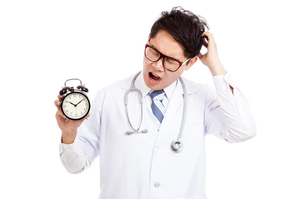 Asian male doctor yawn with a clock — Stock Photo, Image