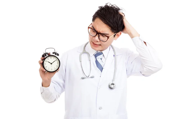 Asian male doctor in bad mood with a clock — Stock Photo, Image