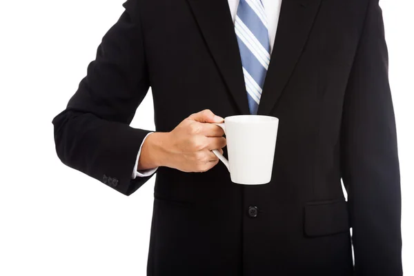 Asijský obchodník drží šálek kávy — Stock fotografie