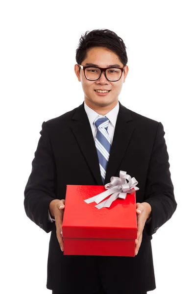 Asian businessman with red gift box — Stock Photo, Image