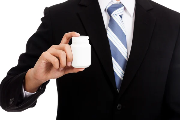 Hombre de negocios asiático con botella de píldora — Foto de Stock