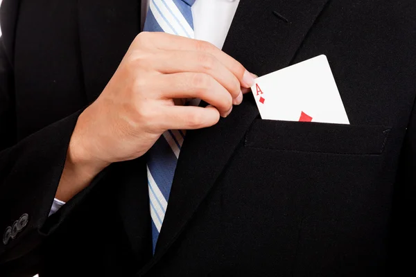 Asian businessman pull playing cards from pocket — Stock Photo, Image