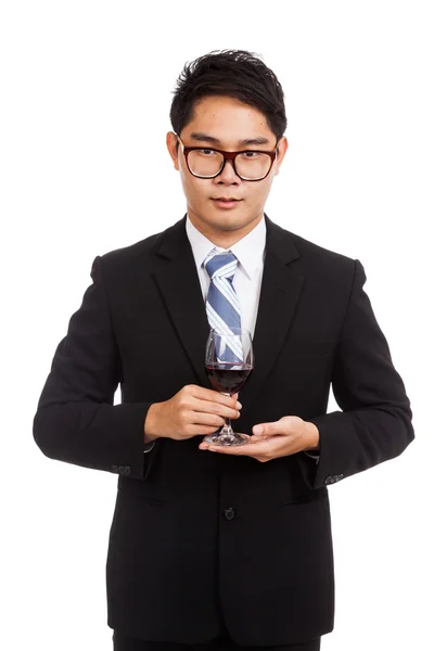 Hombre de negocios asiático con copa de vino tinto — Foto de Stock