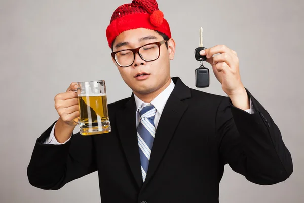 Asian businessman with party hat ,drink beer,get drunk, hold car — Stock Photo, Image