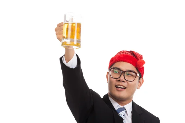 Asian businessman with red  christmas hat cheers with mug of bee — Stock Photo, Image