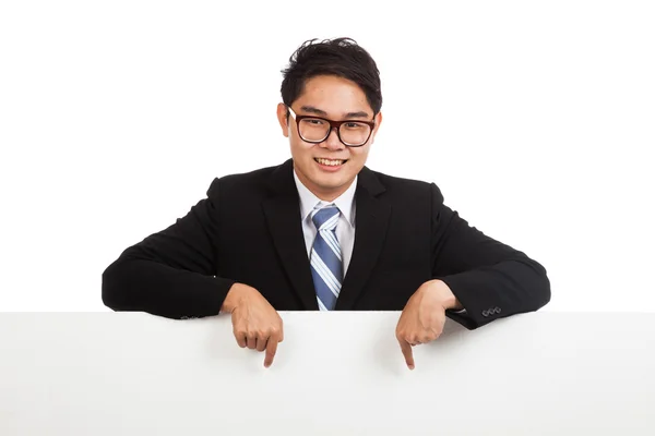 Asian businessman point down behind blank banner — Stock Photo, Image