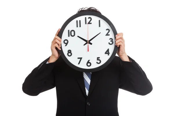 Asian businessman with a clock over face — Stock Photo, Image