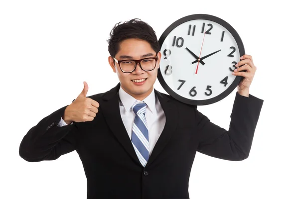 Asian businessman thumbs up with a clock — Stock Photo, Image