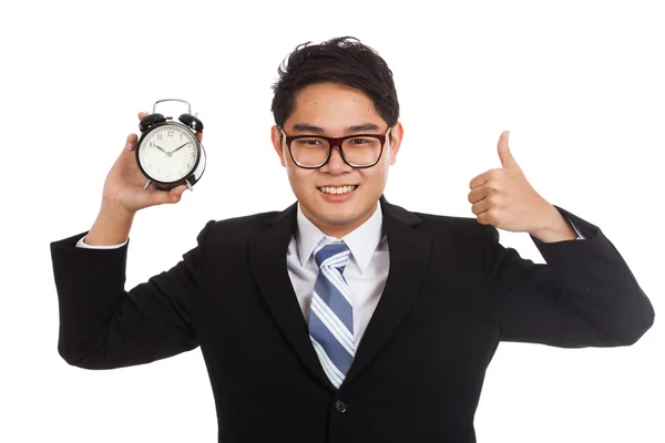 Asian businessman thumbs up with alarm clock — Stock Photo, Image