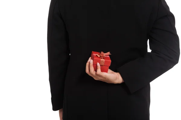 Asiático hombre de negocios ocultar un regalo caja detrás — Foto de Stock