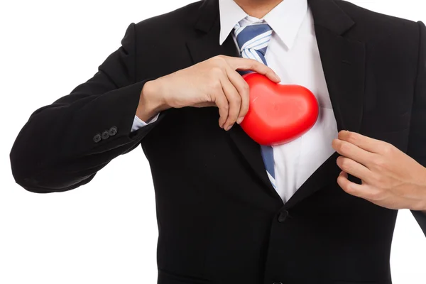Aziatische zakenman pull rode hart van zijn pak — Stockfoto