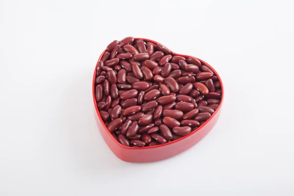 Červené fazole ve tvaru srdce box — Stock fotografie