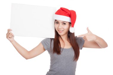 Asyalı kız kırmızı santa şapka ile boş bir işaret noktası