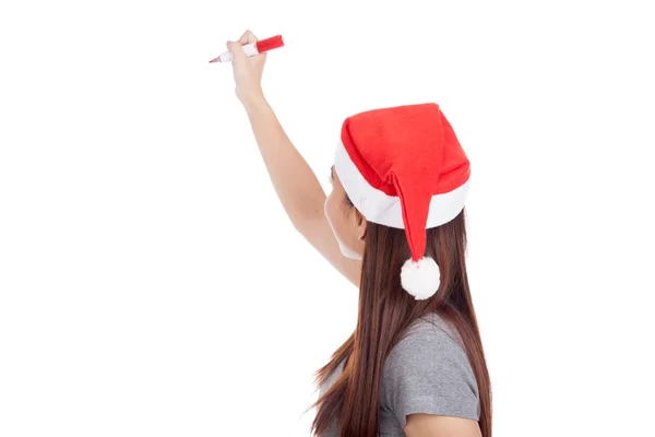 Baksidan av asiatisk tjej med röd santa hatt skriva i luften — Stockfoto