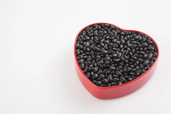 Haricots noirs en forme de coeur boîte — Photo