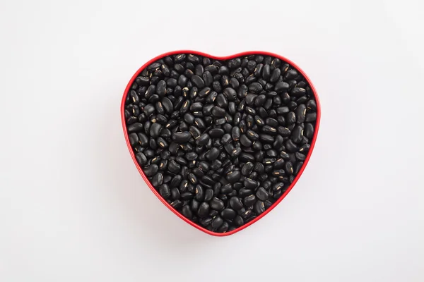 Schwarze Bohnen in Herzform Box — Stockfoto