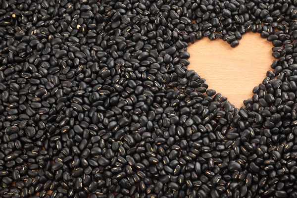 Judías negras con espacio en forma de corazón — Foto de Stock