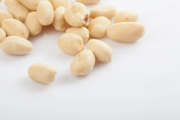 Peeled peanuts on white background — Stock Photo, Image