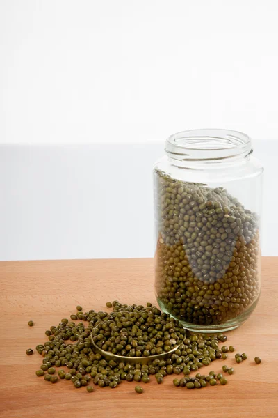 Mung beans in  jar on wood table — Stock Photo, Image