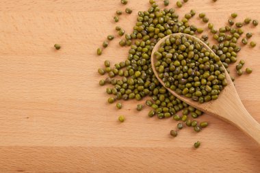 Mung beans with wooden spoon clipart