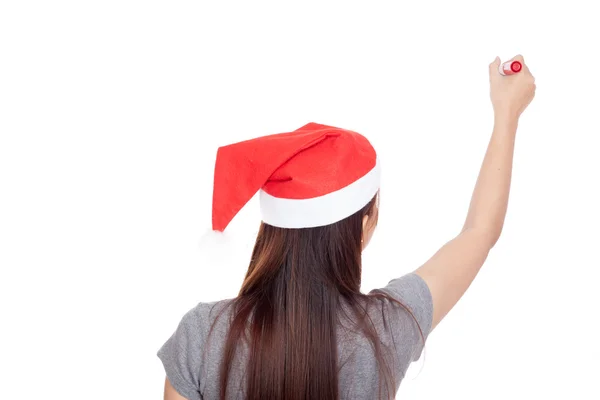 Indietro di ragazza asiatica con cappello rosso di Babbo Natale scrivere in aria — Foto Stock