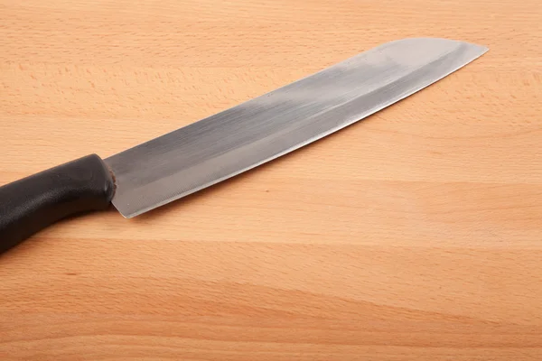 Knife and  wooden chopping board — Stock Photo, Image