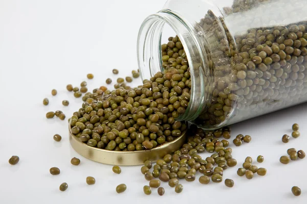 Mung beans in a jar on white  table with lid off — Stock Photo, Image
