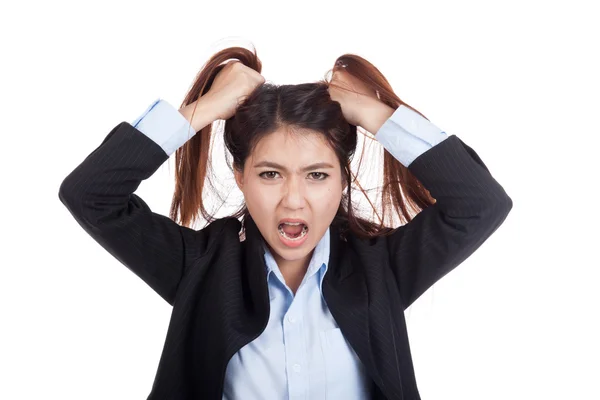 Stressed young Asian businesswoman is going crazy pulling her ha — Stock Photo, Image