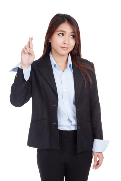 Young Asian businesswoman cross her fingers look away — Stock Photo, Image