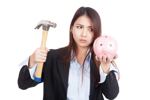 Young Asian businesswoman with hammer and  piggy bank — Stock Photo, Image